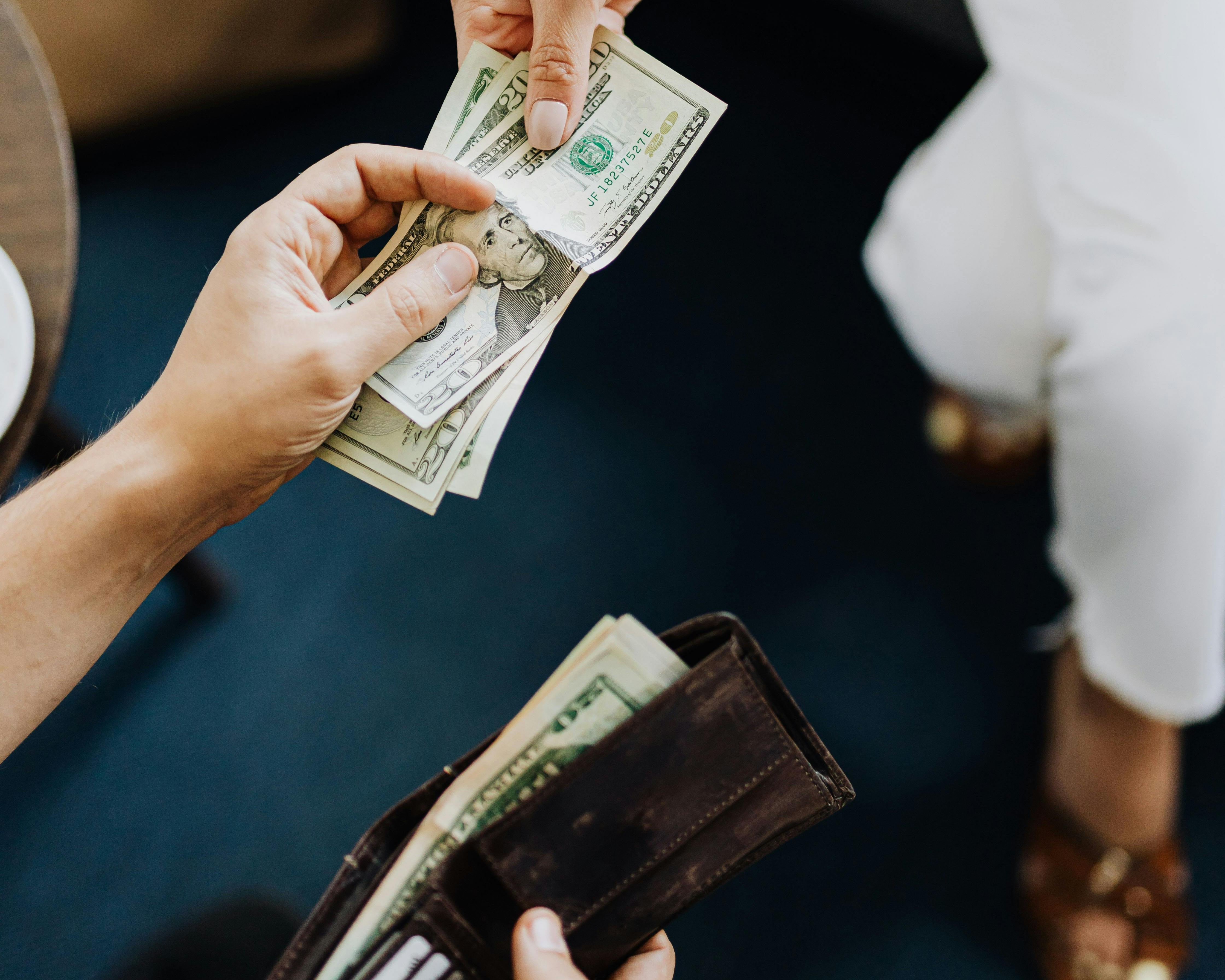 Person handing over cash